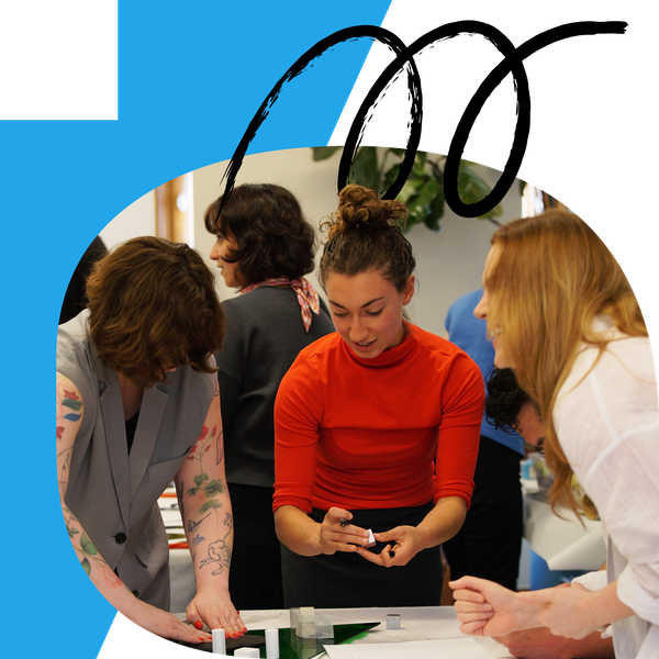 A person working with their hands in a group of others