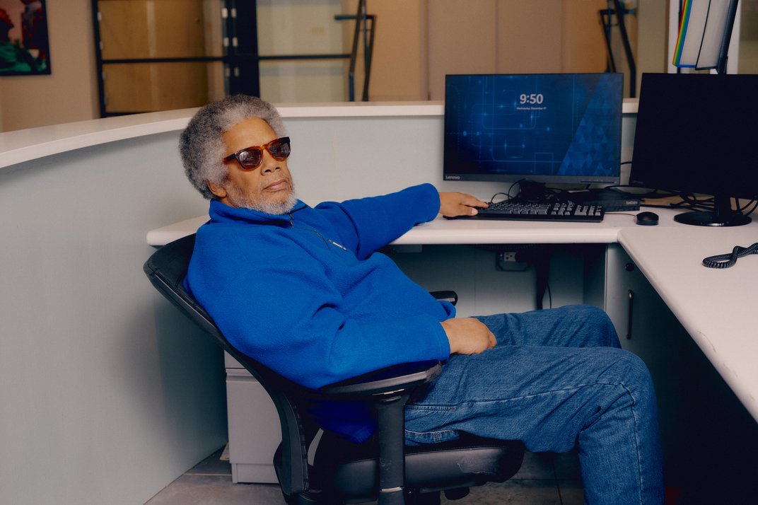 Bruce Roudette using a computer.