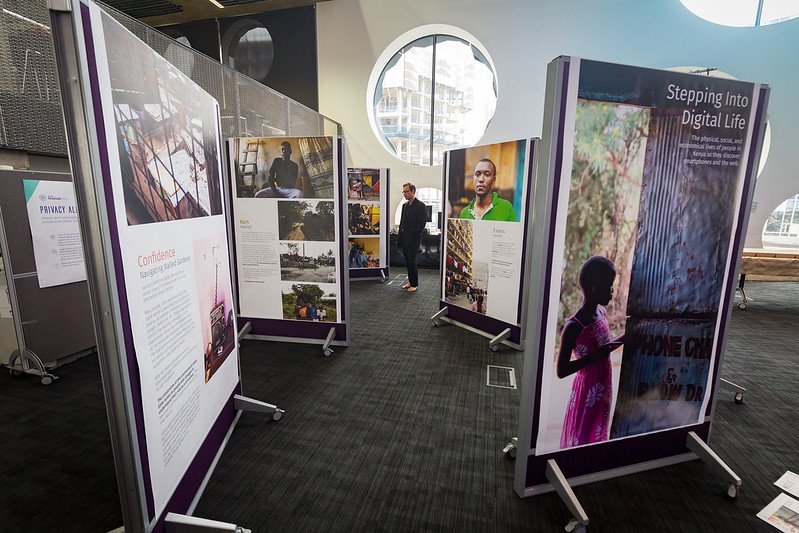 Pop up museum stands featuring panels with information in a large room