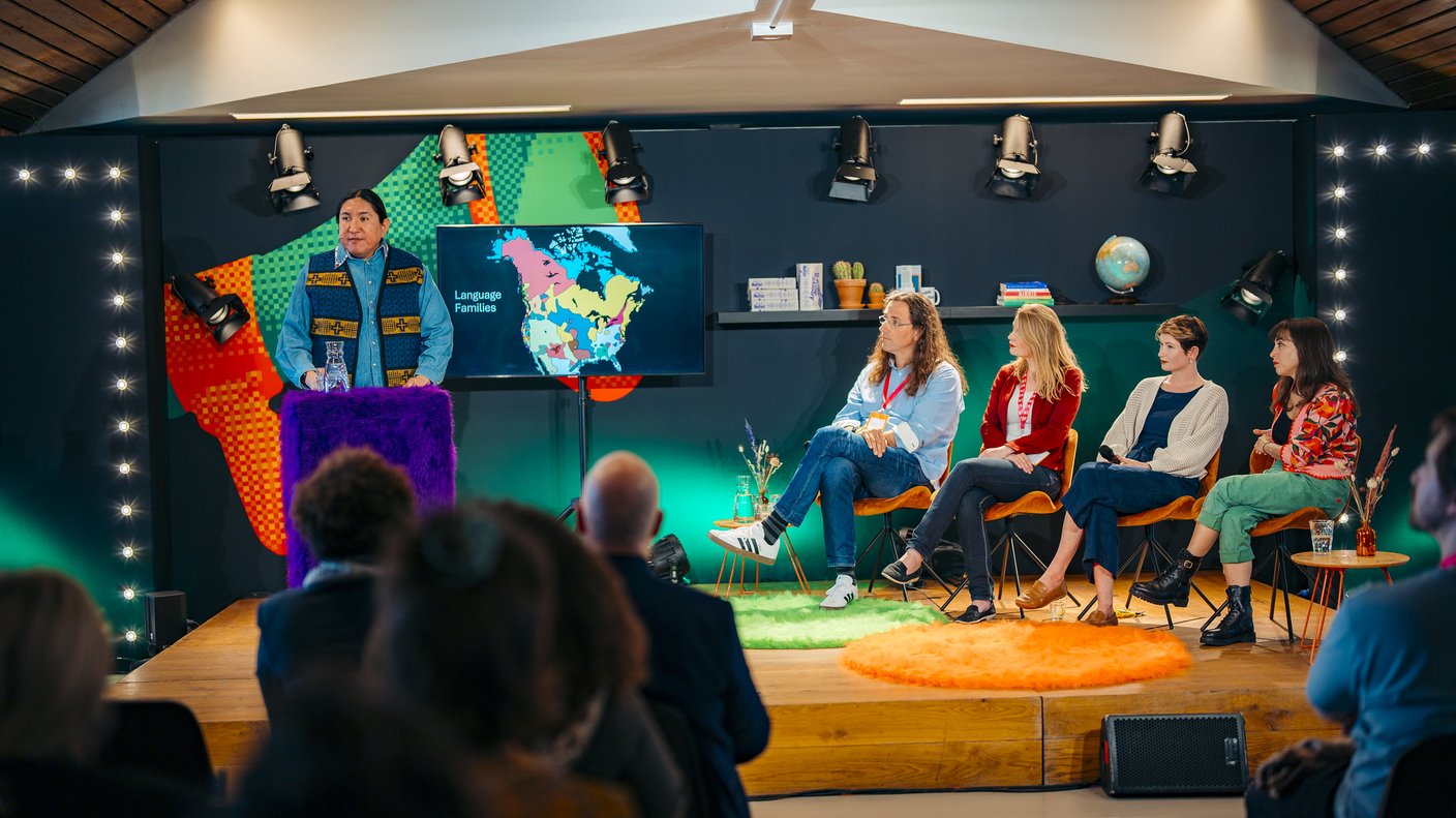 A panel of people at a conference