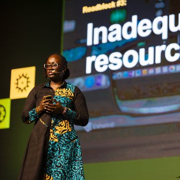 A person giving a talk on a stage