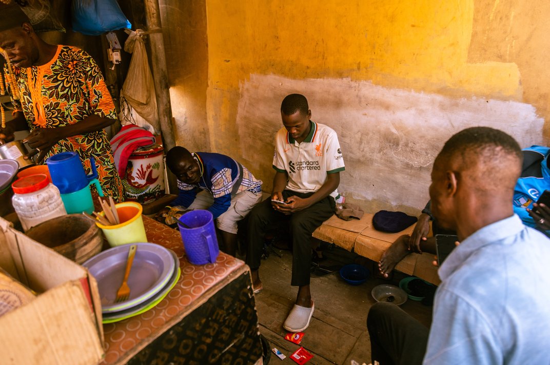 Akbar Aliyu hanging out with other taxi drivers.
