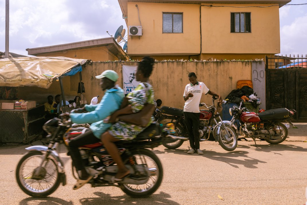 Akbar Aliyu waiting to pick up passengers.