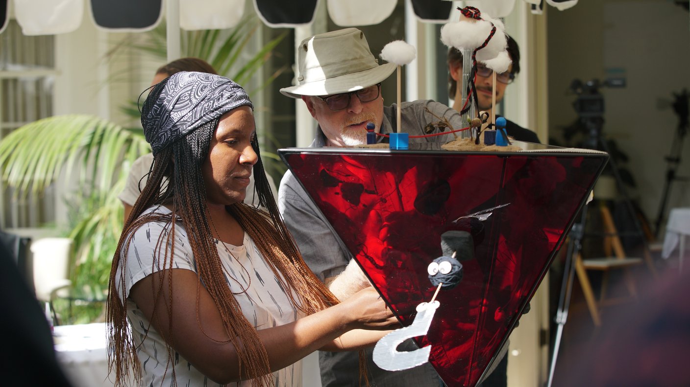 A group of people crafting an artifact together