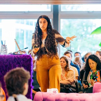 Person speaking infront of an audience