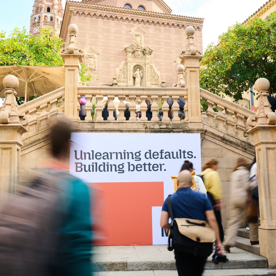 Pariticipants in motion going up and down stairs at Poble Espanyol during Mozilla Fesitval 2025