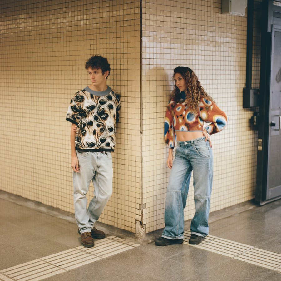 Two models wear designs from Italian anti-surveillance clothing company Cap_able designs.