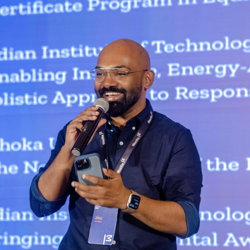 A person giving a talk on a stage