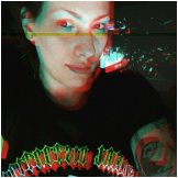 person looking at the camera, with the pixels slightly altered for a computerized look