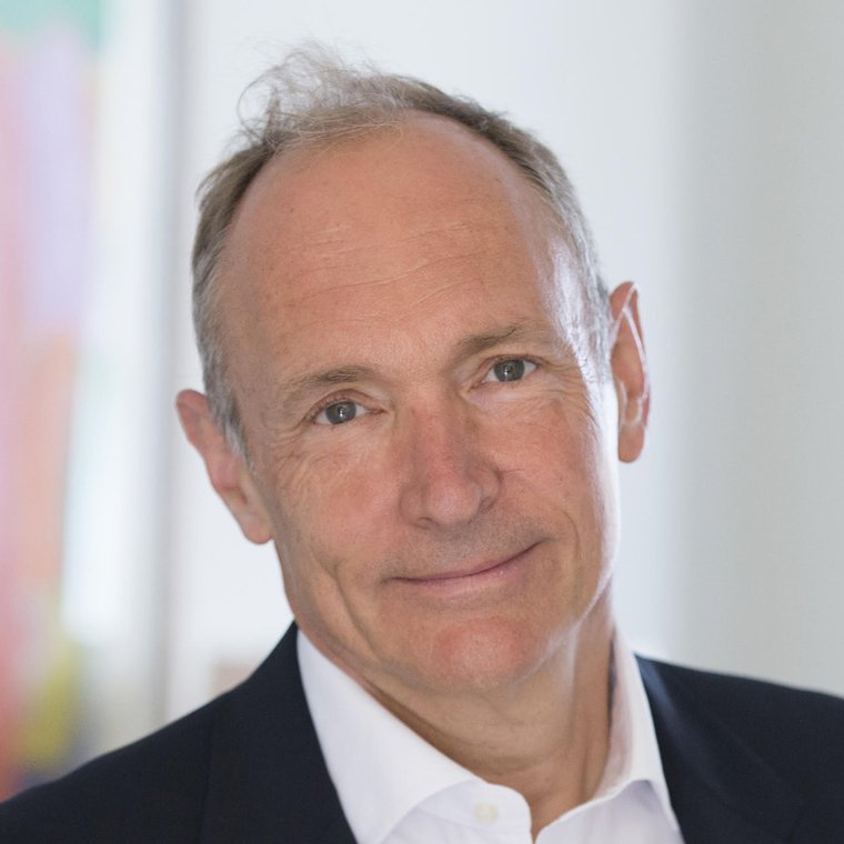 A photograph of Tim Berners-Lee, showing his head and shoulders on a blurred background.