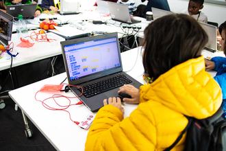Youth Coding on Laptop