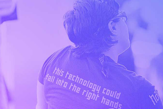 Person wearing a tshirt that says "this technology could fall into the right hands"