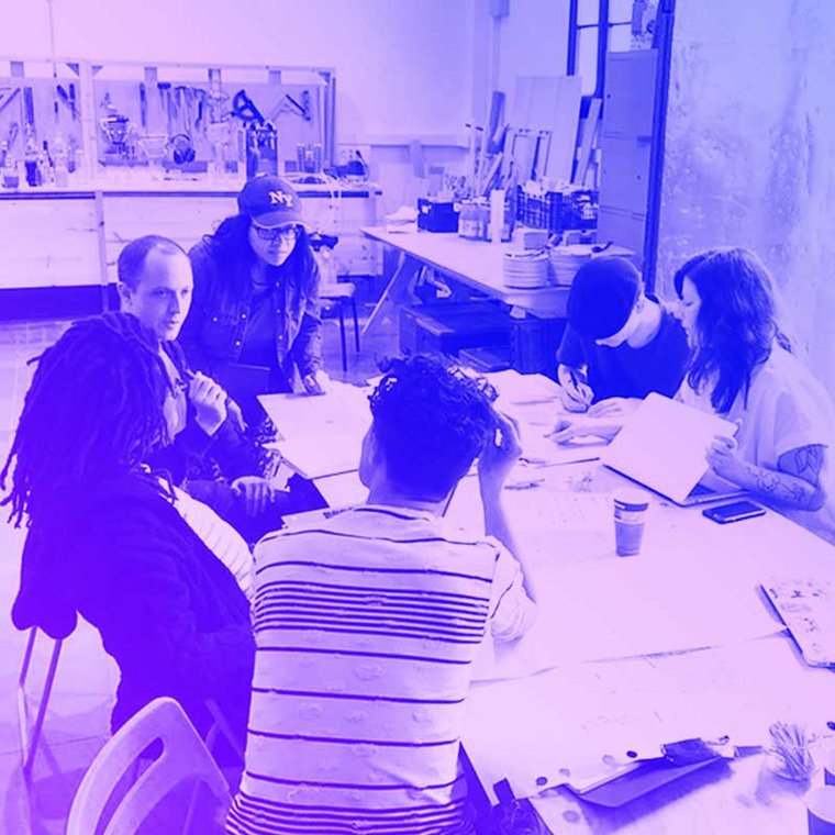 A group of MozFest wranglers sit around the table in discussion