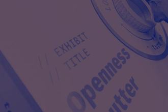 A person stands at an installation looking into a lens. The title of the installation is printing onto the side and reads 'Openness Shutter'
