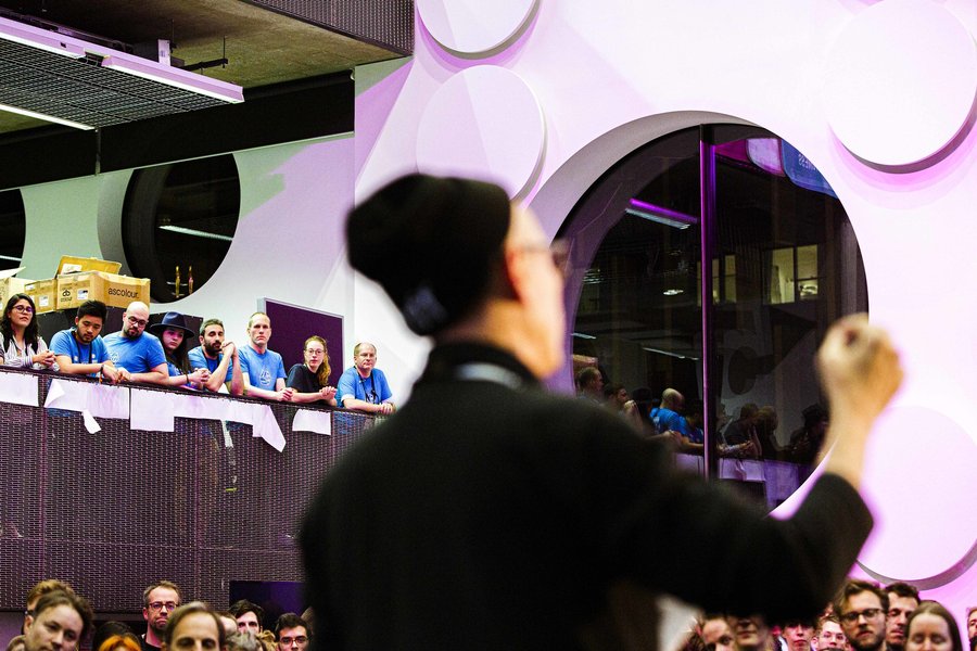 A person speaking onstage at the Mozilla Festival